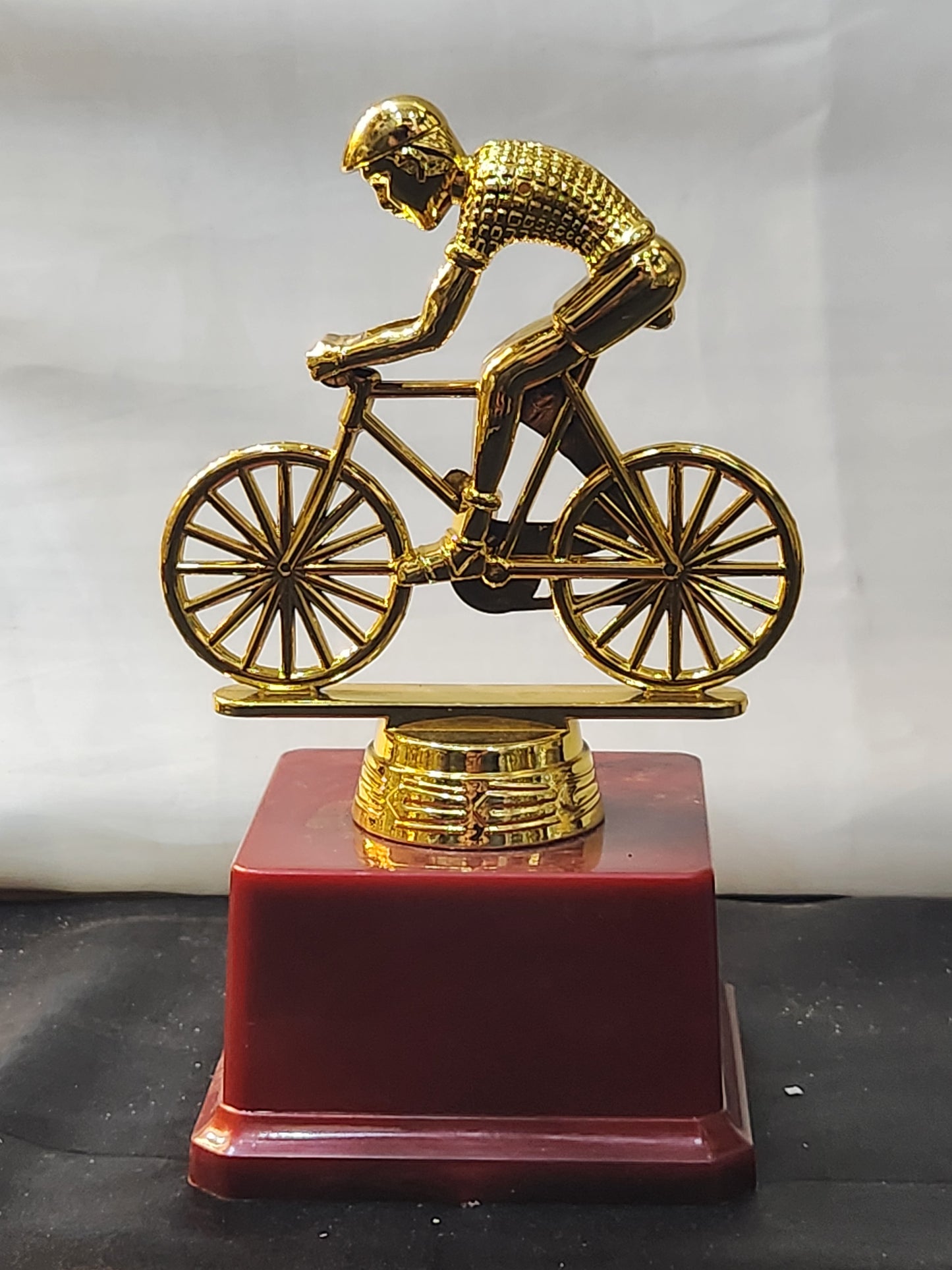 Cycling trophy with golden finish