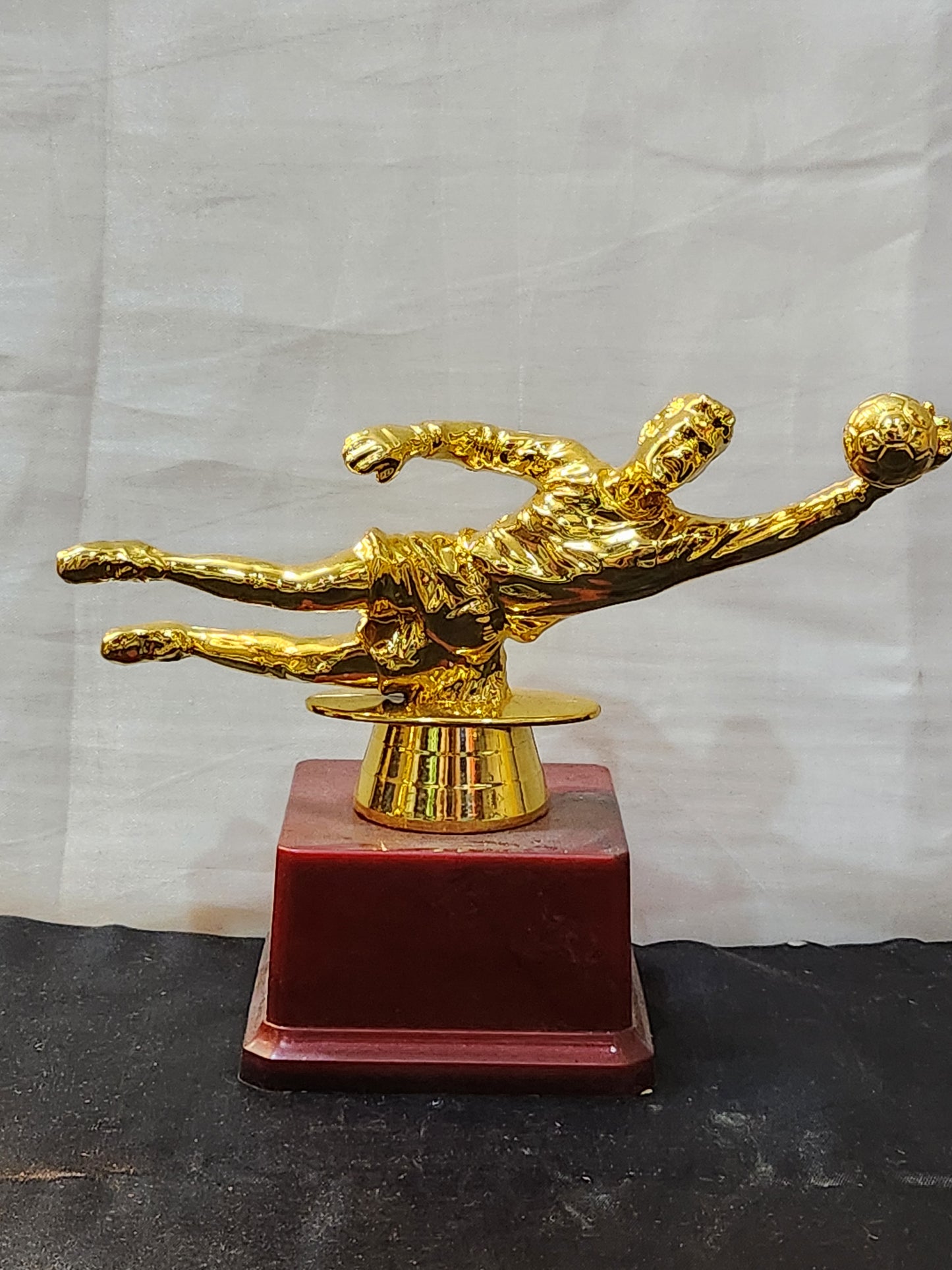 Football trophy with golden finish